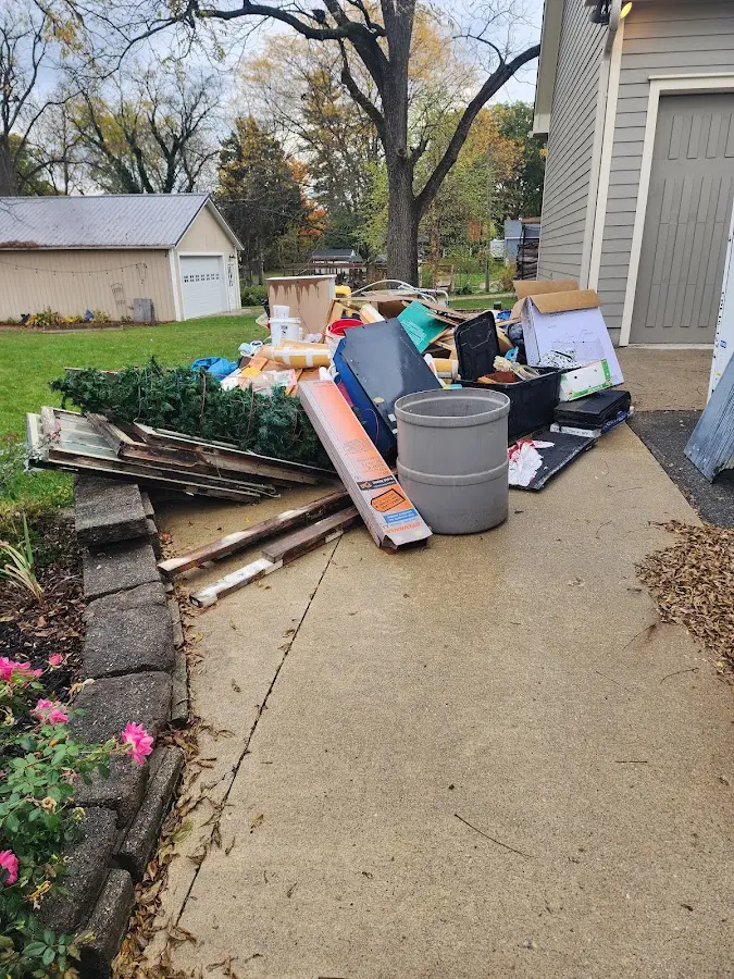 Dumpster being loaded with debris for Demolition Dumpster Rental in Basalt